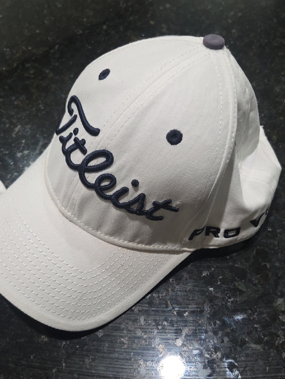 Titleist White Cap with Navy Script Logo. Adjustable, One Size Fits All